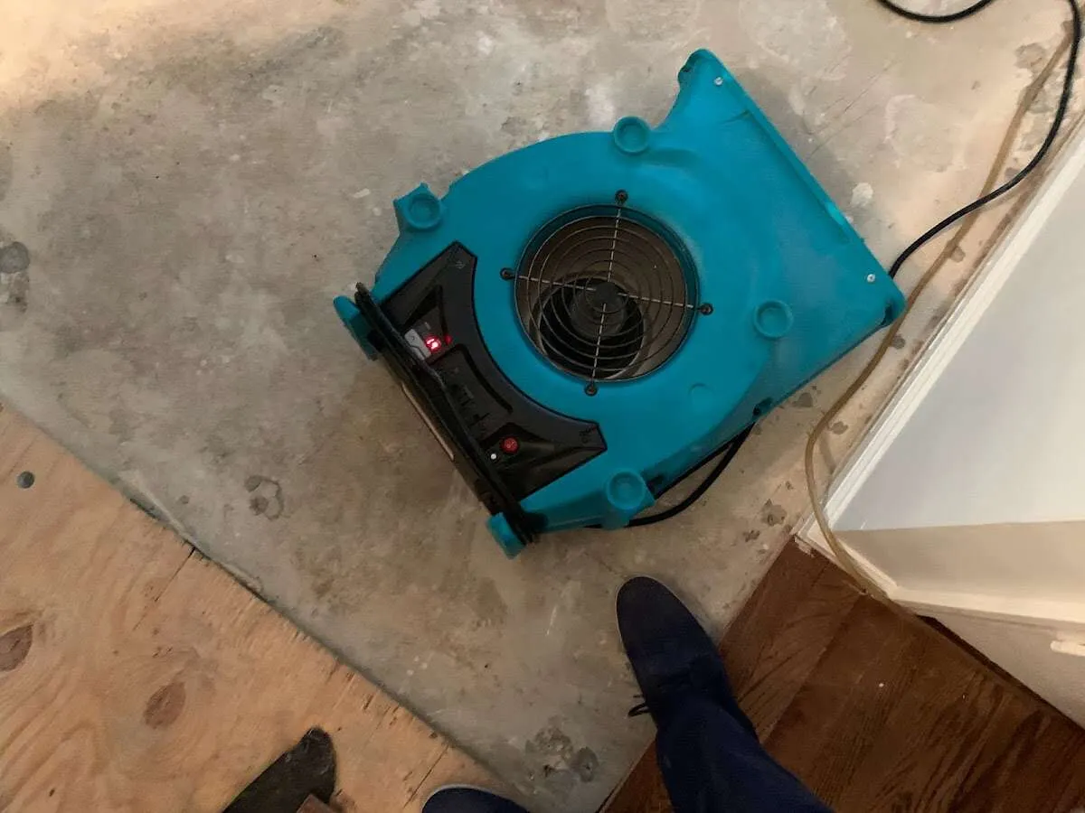 Air mover drying subfloor during Leak Detection & Repair in Bolingbrook